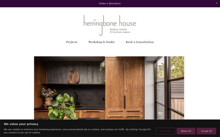 Screenshot of herringbonehouse.com